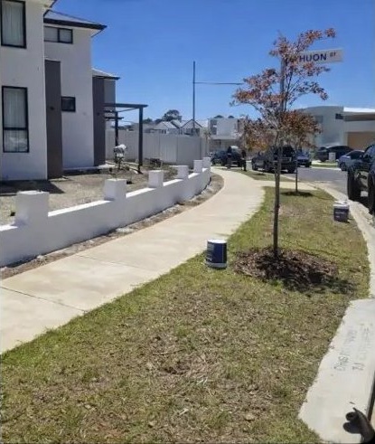 After: new front boundary wall rendered and finished in white